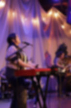 A keyboard player leading a worship service